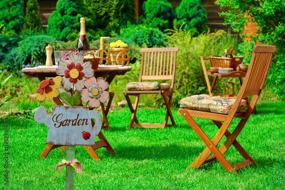 Sign Garden On The Wooden Plate And Wooden Outdoor Furniture Sign Garden On The Wooden Plate And Wooden Outdoor Furniture