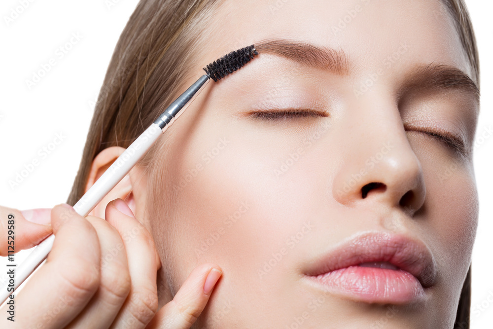 Woman correcting eyebrows form Woman correcting eyebrows form