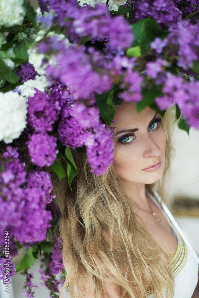 Young beautiful woman posing with spring flowers. Gorgeous natur Young beautiful woman posing with spring flowers. Gorgeous natur