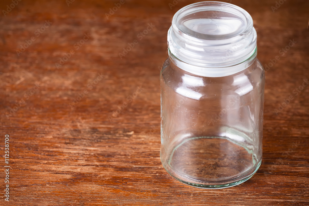 Empty jar dark wooden background savings. Empty jar dark wooden background savings.