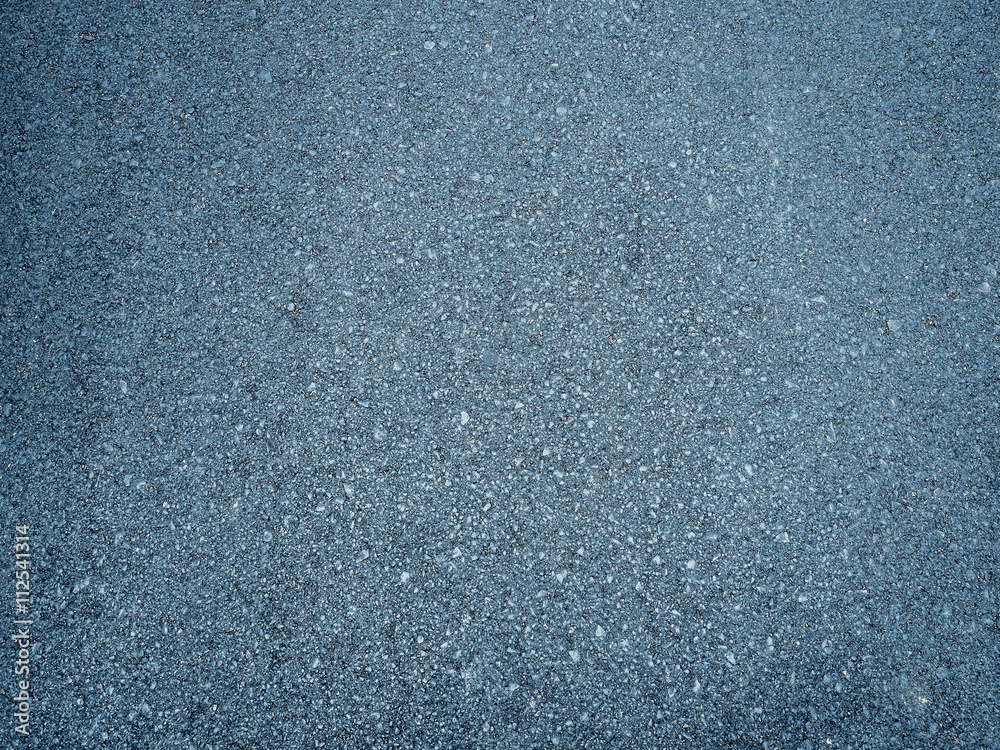 dark and rough asphalt surface in the road