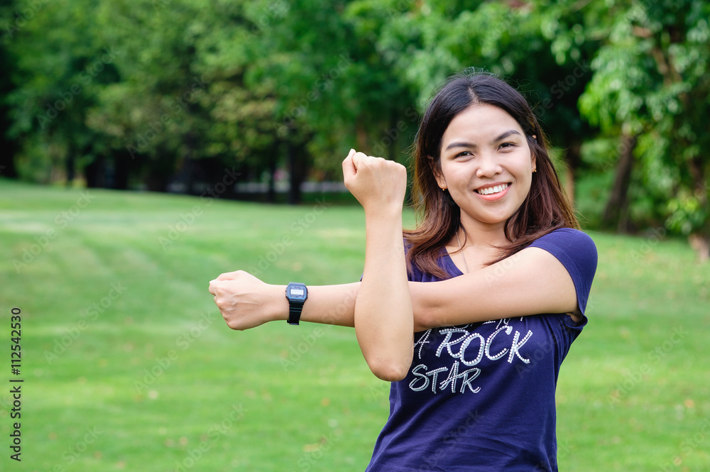 healthy lifestyle - Young happy woman in green field, relaxing action in green field public park, fresh relax exercise asian woman healthy lifestyle - Young happy woman in green field, relaxing action in green field public park, fresh relax exercise asian woman
