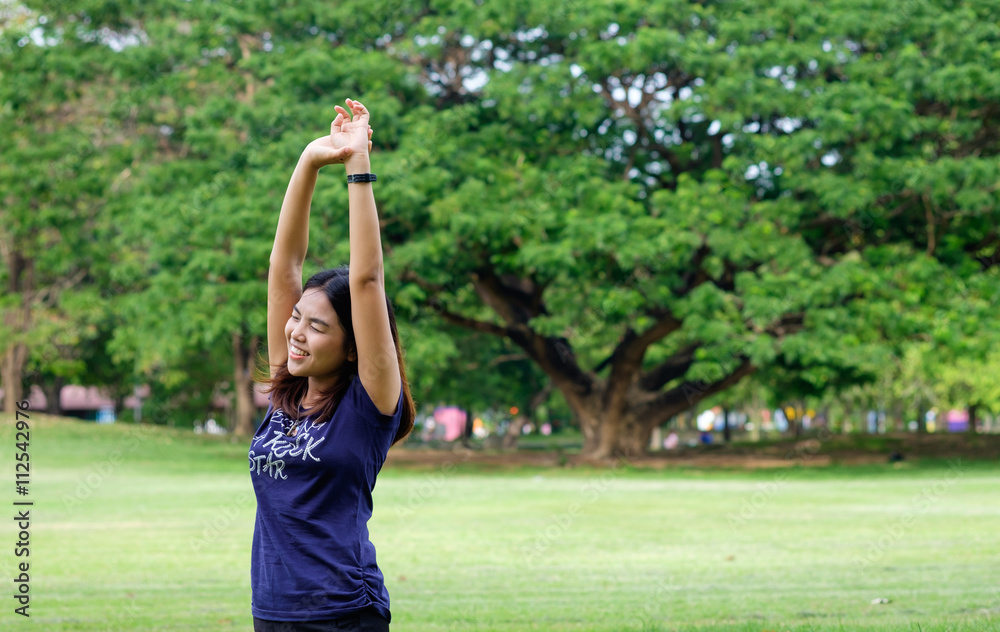 healthy lifestyle - Young happy woman in green field, relaxing action in green field public park, fresh relax exercise asian woman healthy lifestyle - Young happy woman in green field, relaxing action in green field public park, fresh relax exercise asian woman