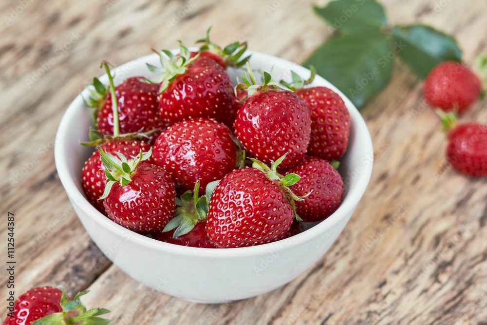 Bowl filled with juicy fresh ripe red strawberries. horizontal Bowl filled with juicy fresh ripe red strawberries. horizontal