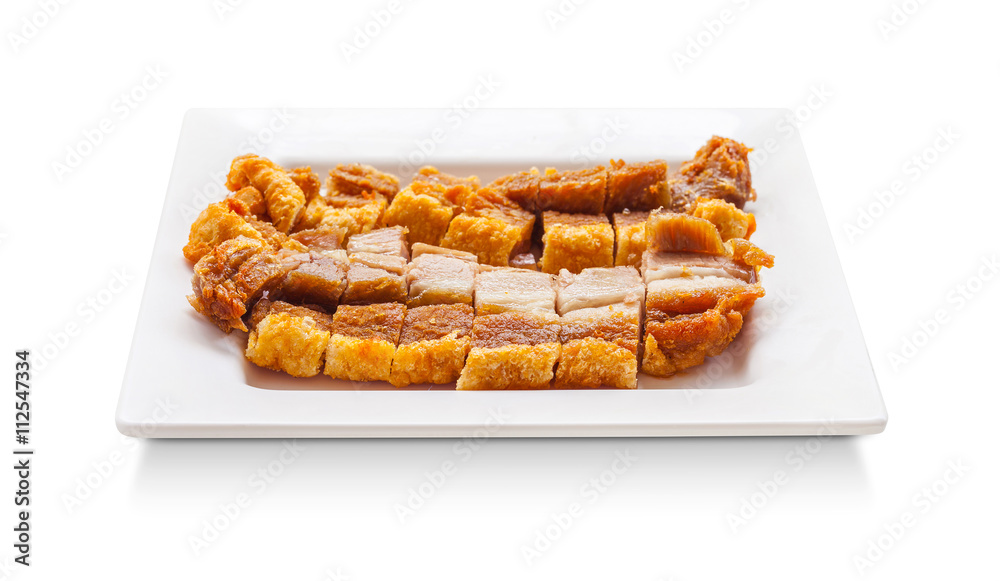 crispy pork slice on dish isolated on white background crispy pork slice on dish isolated on white background