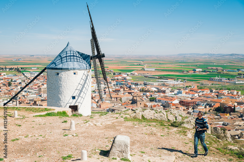 Man visiting traditional spanish windmills, Toledo, Spain - obrazy, fototapety, plakaty 
