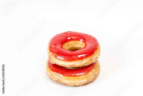 Strawberry red glazed donuts isolated on white background,  in column 