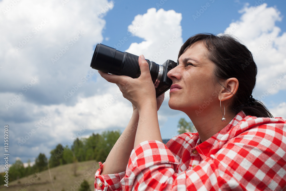 young woman outdoor photographer