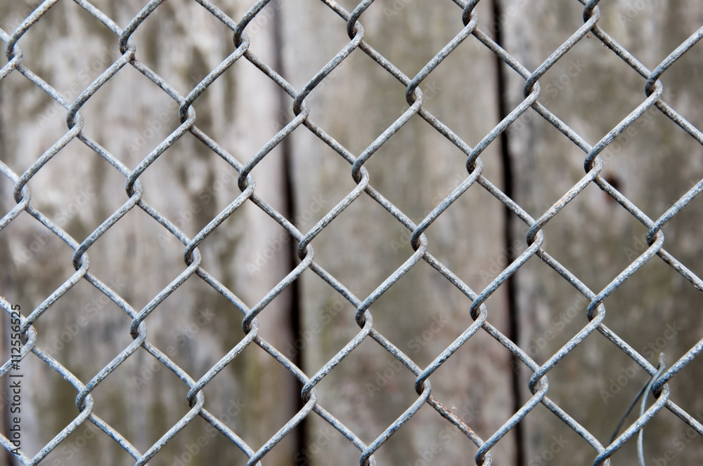 Metal grid and wooden board texture Metal grid and wooden board texture