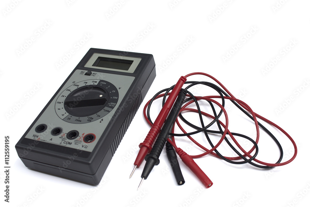 Digital multimeter with LCD display isolated on white background. Red and black wires. Digital multimeter with LCD display isolated on white background. Red and black wires.