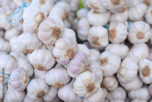 Closeup on garlic in sacks at market