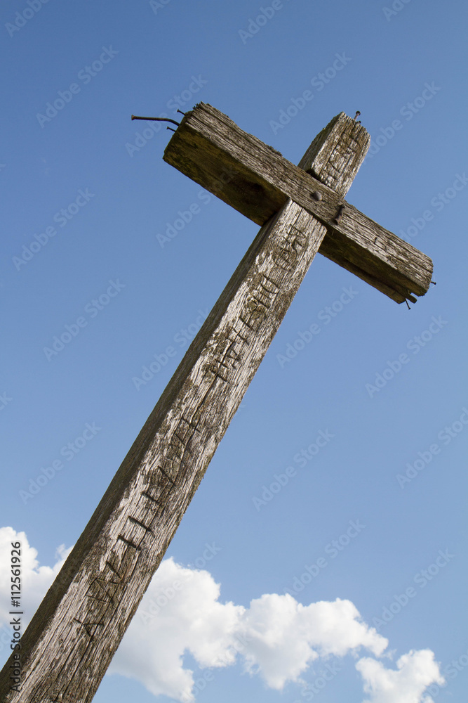 Wooden cross against blue sky