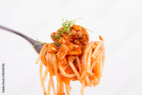 Spaghetti bolognese with garlic on a fork