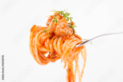 Spaghetti bolognese with garlic on a fork