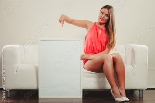 Cute fashion woman with blank empty white banner.