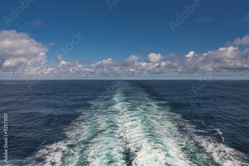 Clouds blue sky and ship track in Atlantic ocean, summer time © neurobite