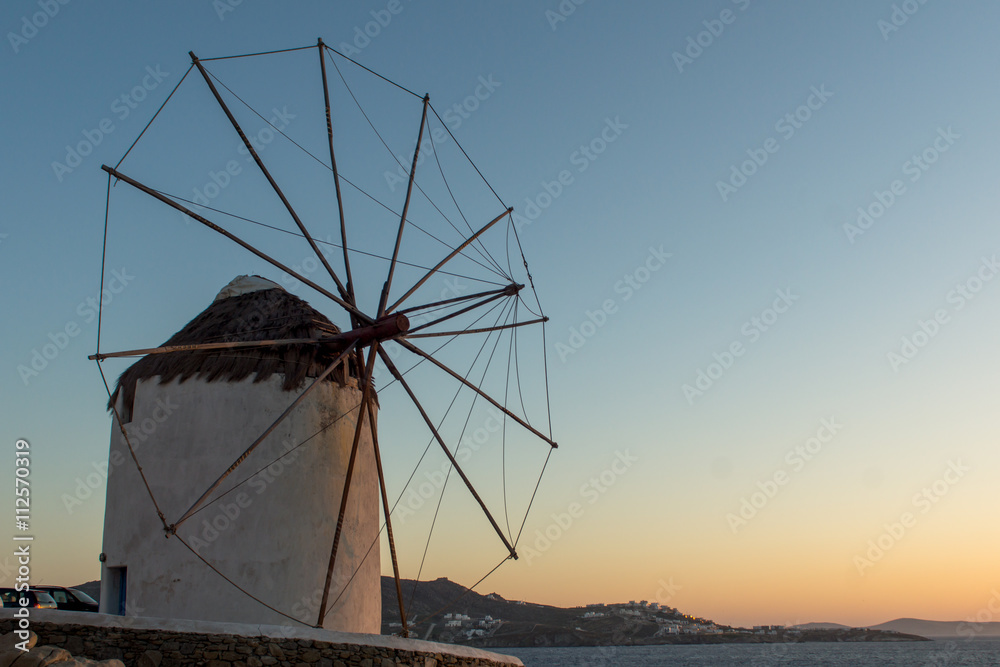 Amazing Sunset and White windmills on the island of Mykonos, Cyclades, Greece - obrazy, fototapety, plakaty 