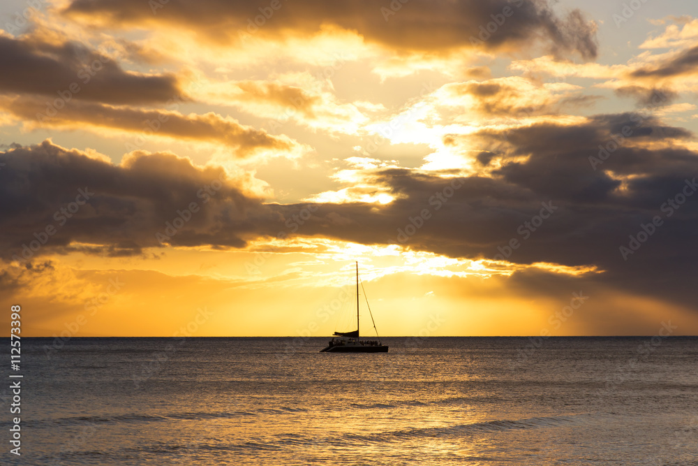 Yacht in the tropical sea at sunset Yacht in the tropical sea at sunset