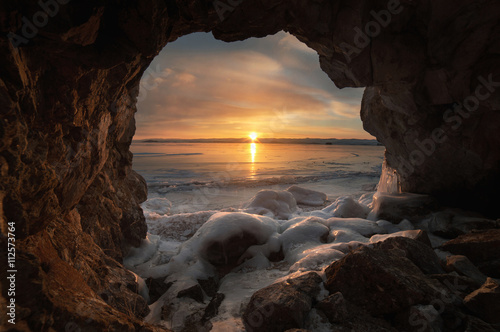 Sunrise in ice cave, Lake Baikal, Russia