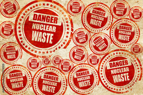 Nuclear danger background, red stamp on a grunge paper texture
