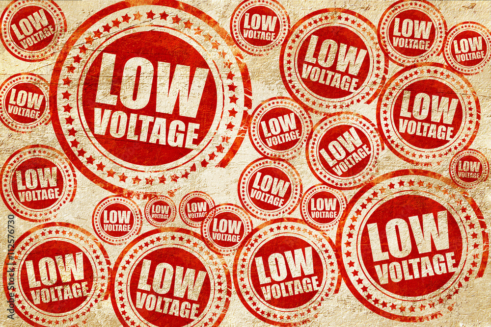 Obraz premium low voltage, red stamp on a grunge paper texture