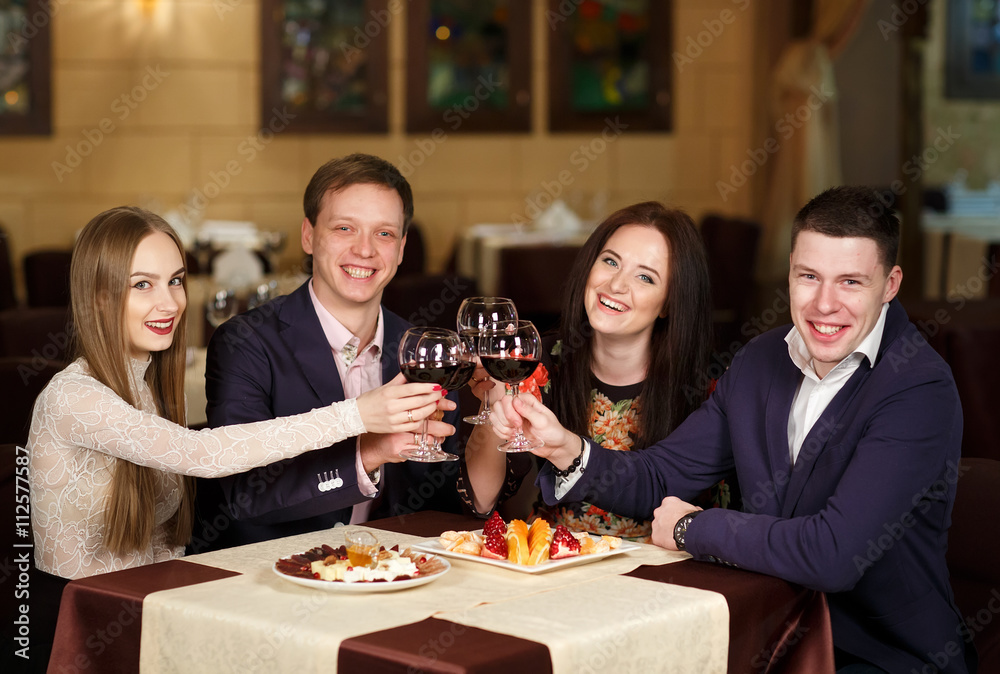Friends at a restaurant drinking wine. Friends at a restaurant drinking wine.