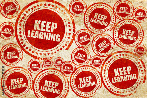 keep learning, red stamp on a grunge paper texture
