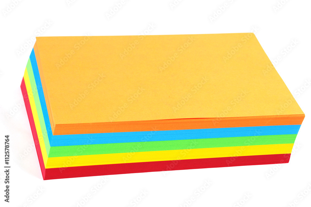 Fototapeta premium stacking colored papers isolated in white background