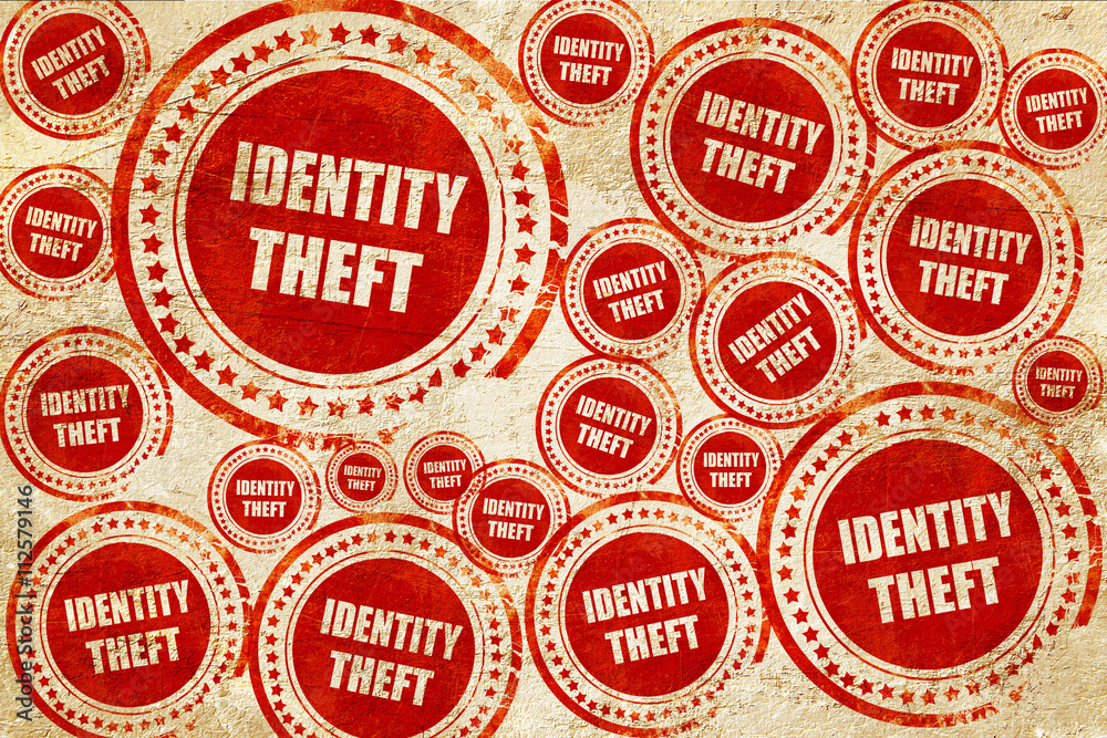 Identity theft fraud background, red stamp on a grunge paper tex Identity theft fraud background, red stamp on a grunge paper tex