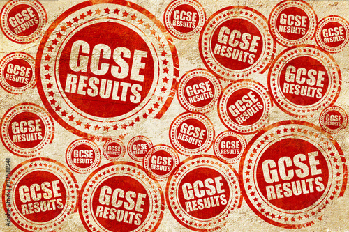 gcse results, red stamp on a grunge paper texture photo