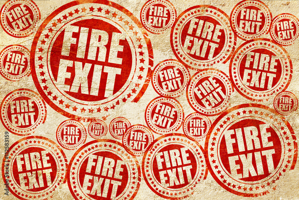 fire exit, red stamp on a grunge paper texture fire exit, red stamp on a grunge paper texture