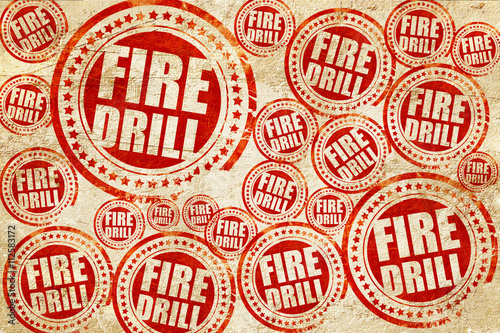 fire drill, red stamp on a grunge paper texture