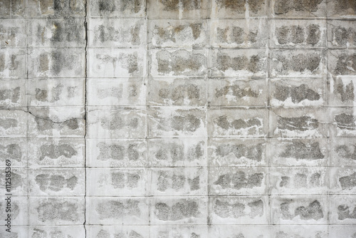 damaged white brick wall