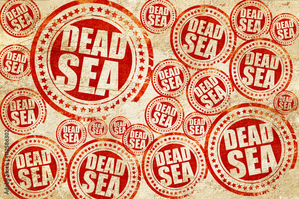 dead sea, red stamp on a grunge paper texture dead sea, red stamp on a grunge paper texture