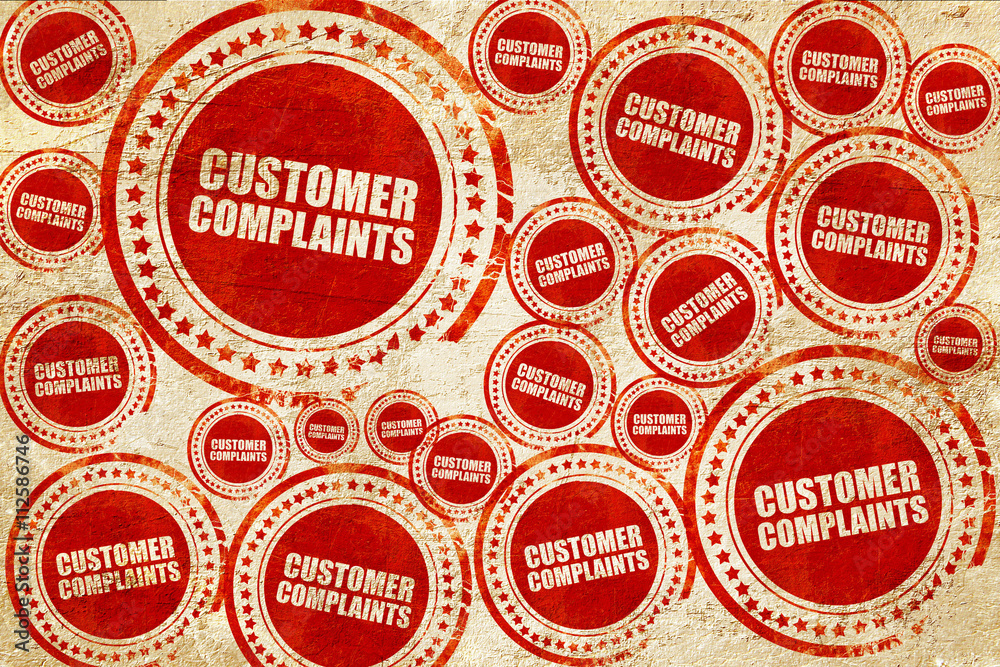 Obraz premium customer complaints, red stamp on a grunge paper texture