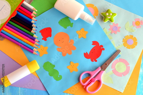 Paper marine animals and flowers cards. Glue stick, rubber, scissors, color paper, pencils. Creative and easy way to build up children imagination. Promote creative ability. Kindergarten art activity