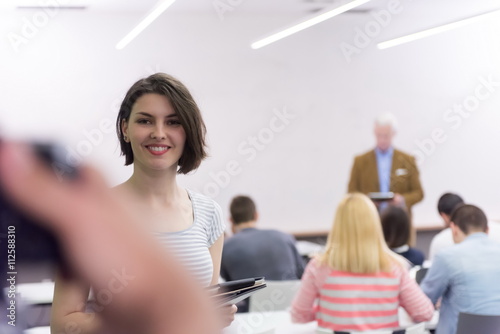 portrait of happy female student in classroom