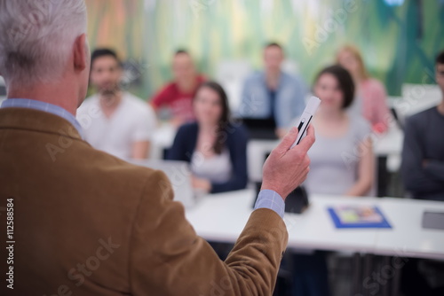 teacher with a group of students in classroom