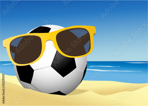Football on a beach sand