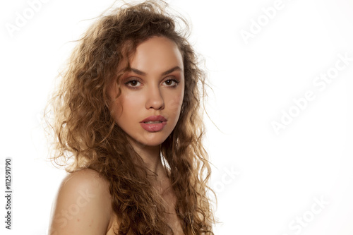 Portrait of a young beautiful woman on a white background