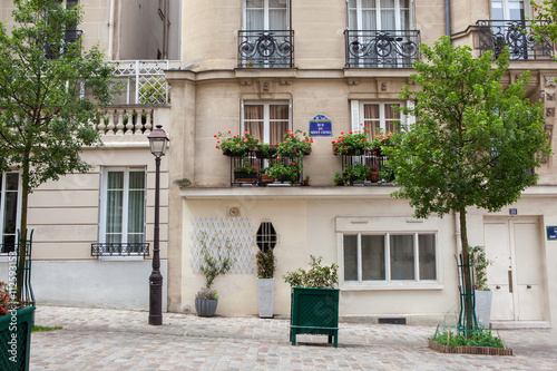 Public painter with his paintings in Place du Tertre square photo