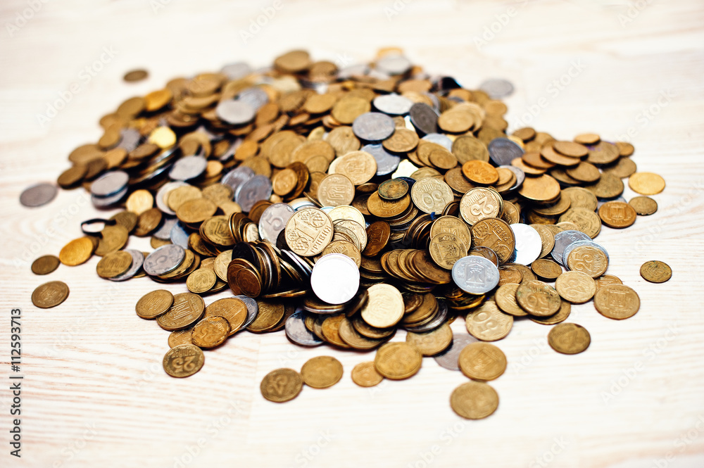 Mountain coins on wooden background Mountain coins on wooden background