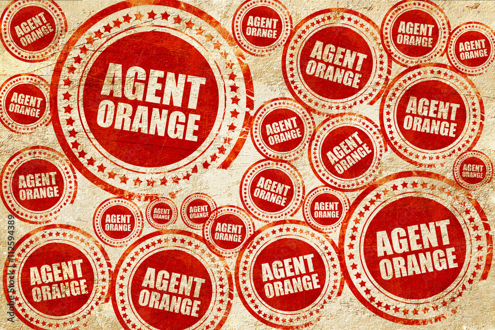 agent orange, red stamp on a grunge paper texture