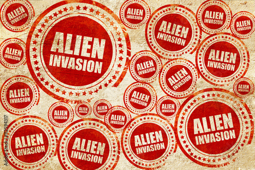 alien invasion  red stamp on a grunge paper texture
