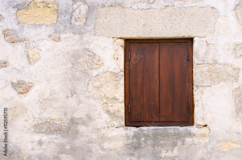 Window with brown shutters