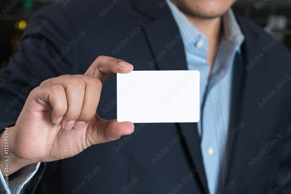Business man handing a blank business card
Business man handing a blank business card