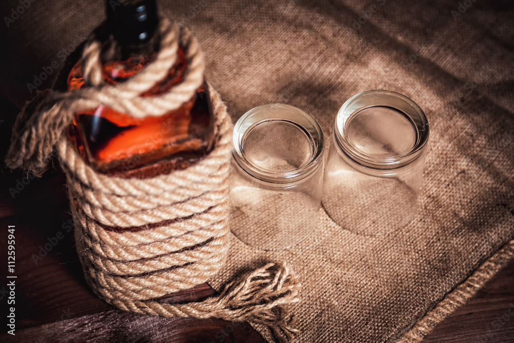 Obraz premium whiskey aged elite alcohol on wooden background