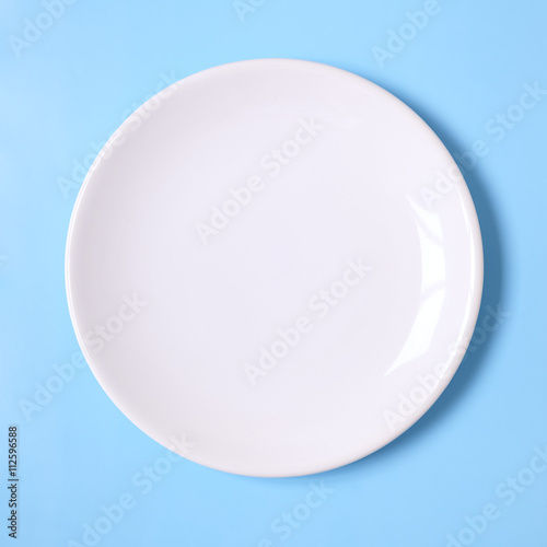 White plate on a blue background