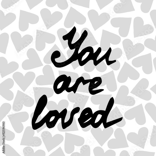 Lettering You are loved on the background with heart
