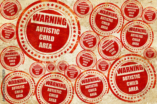 Autistic child sign, red stamp on a grunge paper texture